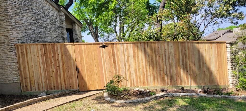 Newly installed wooden privacy fence